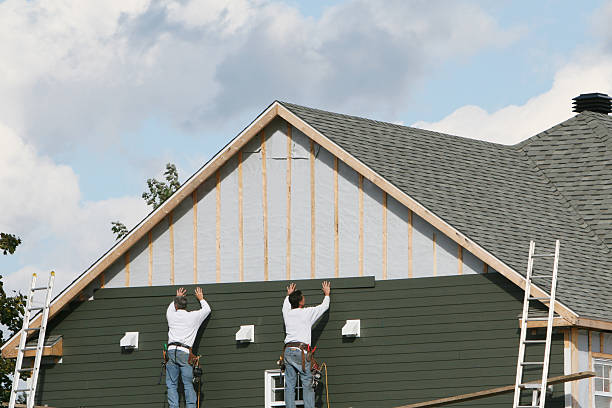 Professional Siding Contractor technician working in Dola, OH